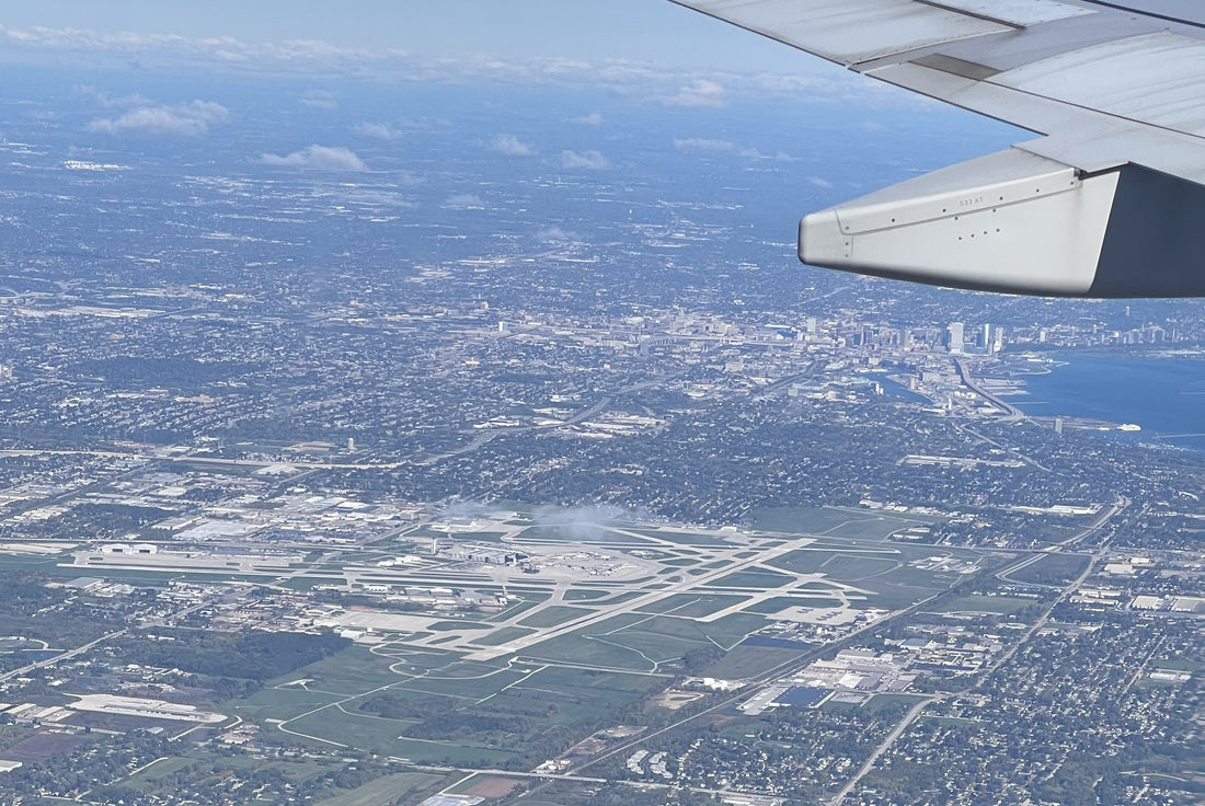 Aerial photo of airport and city skyline